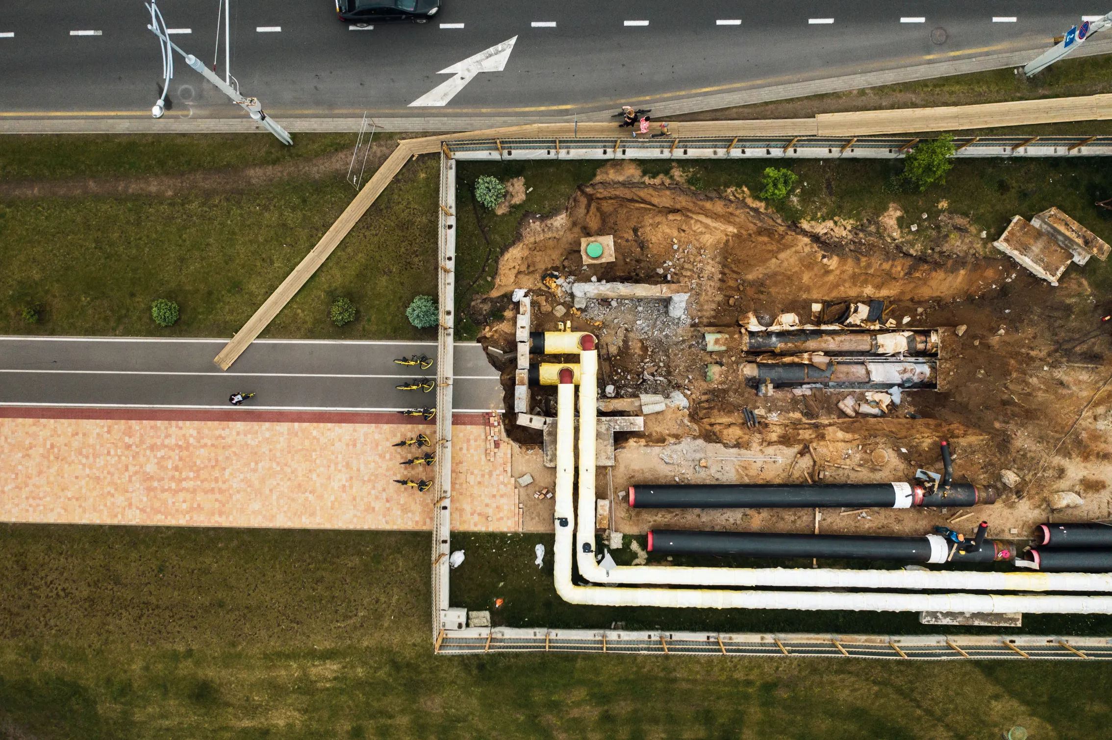 aerial view of pipeline excavation and replacement along road