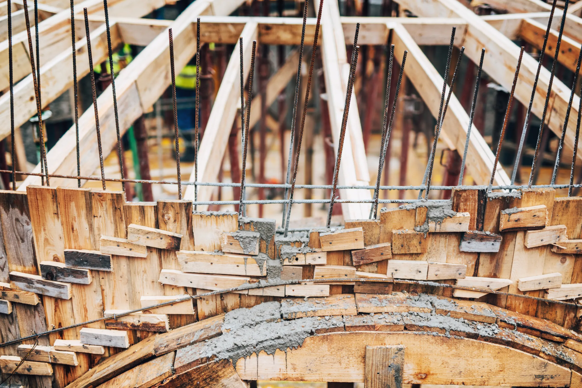 circular wooden and steel formwork structure under construction